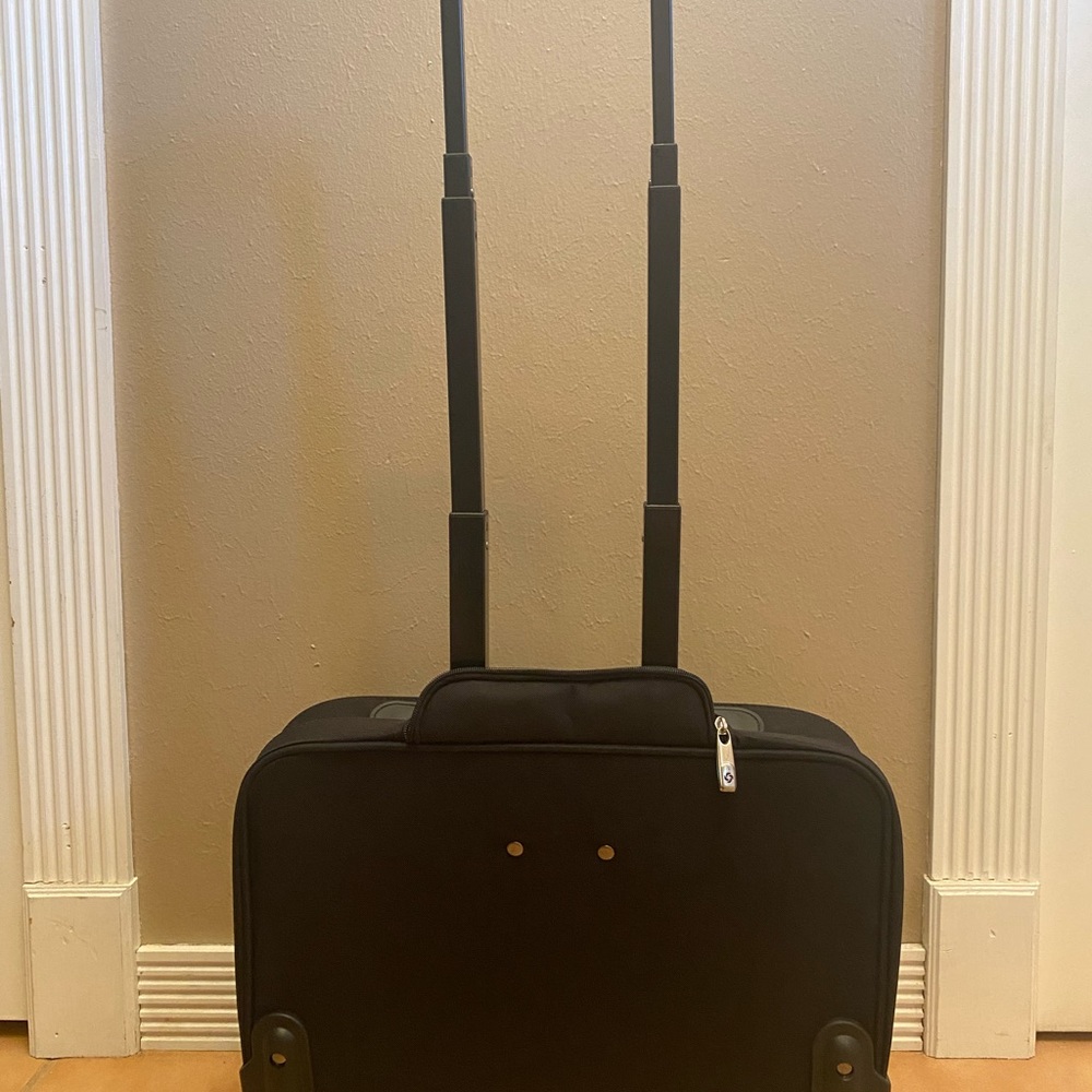 Brand new Samsonite rolling carry-on bag